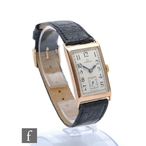 227 - A 9ct hallmarked Gentleman's, manual wind Omega wristwatch, Arabic numerals to a silvered rectangula... 