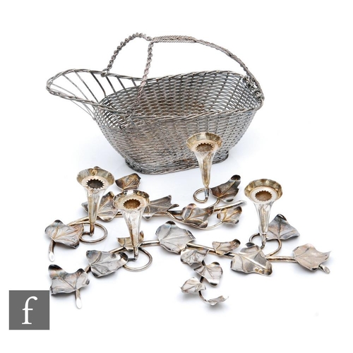 50 - Two Spanish silver table decorations each modelled as an ivy branch supporting two candle sconces, l... 