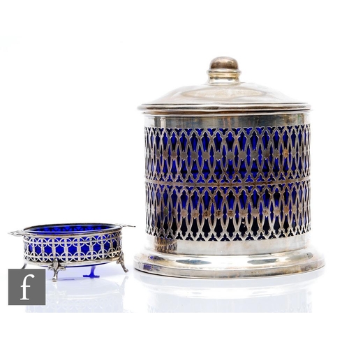 63 - A hallmarked silver cylindrical biscuit barrel, plain stepped base below pierced sides encompassing ... 