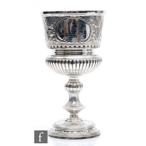 71 - An early 20th Century hallmarked large silver goblet, circular base below knop stem, part fluted and... 