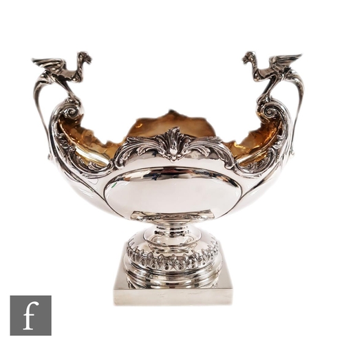 73 - An early 20th Century hallmarked silver table centre piece, square base supporting boat shaped bowl ... 