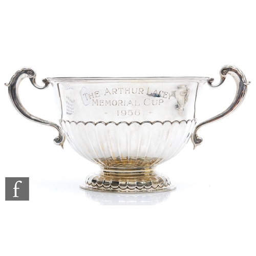 76 - A hallmarked silver pedestal bowl with part fluted decoration and presentation engraving, terminatin... 