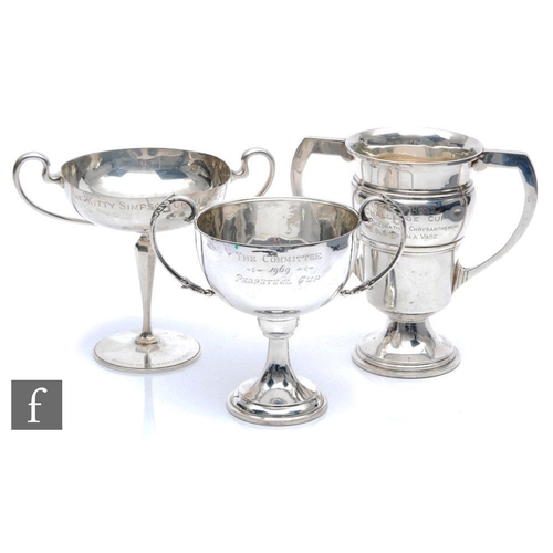 77 - Three hallmarked silver twin handle trophies each with presentation engravings, total weight 34.5oz,... 