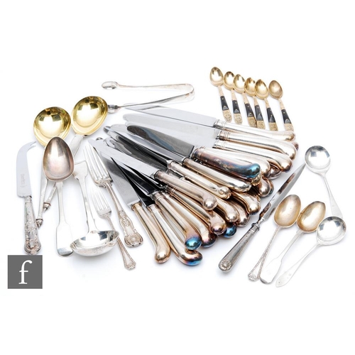 83 - A parcel lot of assorted hallmarked silver flat ware to include a sauce ladle, two serving spoons, s... 