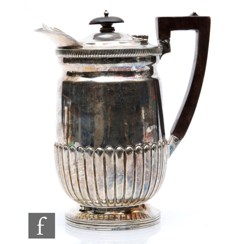 87 - A hallmarked silver hot water pot with part fluted decoration terminating in angular wooden handle, ... 