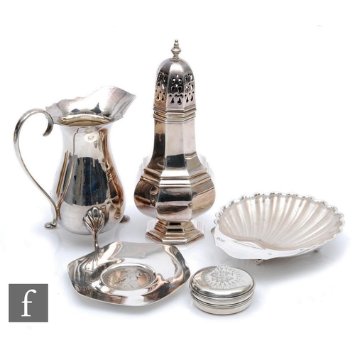 99 - Five items of hallmarked silver, a cream jug, a sugar castor, a butter dish, a pin dish and a host b... 