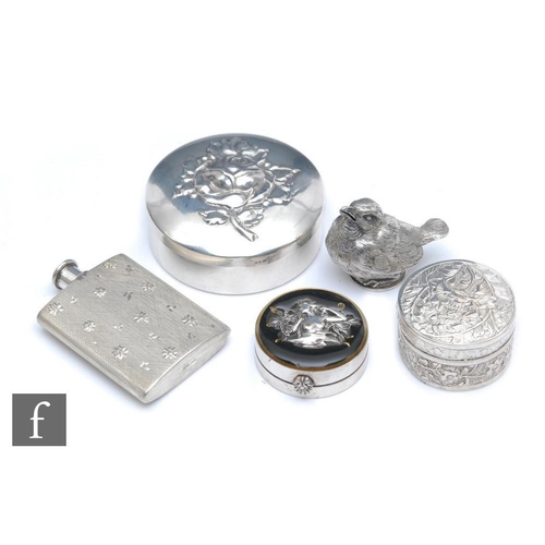 213 - A small French white metal menu or place card holder formed as a bird, together with a silver ring b... 