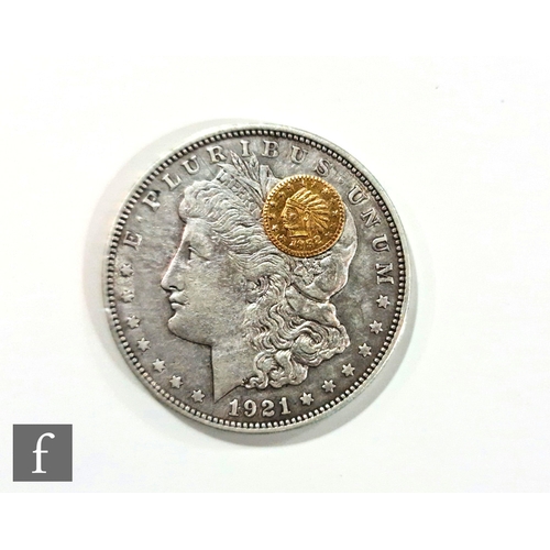 757 - An American 1921 Morgan dollar with a Californian 1852 fractional gold coin. (2)