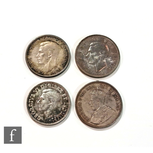 768 - An Australian 1937 Wreath crown, 1949 New Zealand crown, a Canadian 1938 dollar and a 1928 Cyprus fo... 