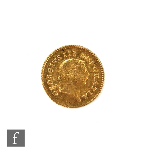 780 - A George III 1804 one third of a Guinea.