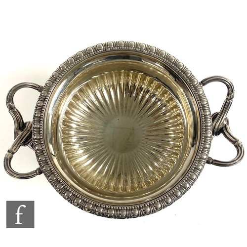 70 - A hallmarked silver pedestal bowl modelled in the manner of The Warwick Vase, square base rising to ... 