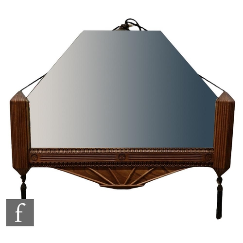 1006 - An Art Deco mirror of geometric form, with a carved wood half frame and tassels, height 49cm x 68cm.