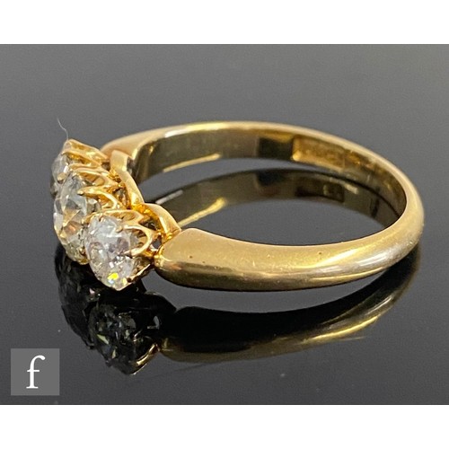 344 - An early 20th Century 18ct diamond three stone ring, old cut claw set stones, total weight approxima... 