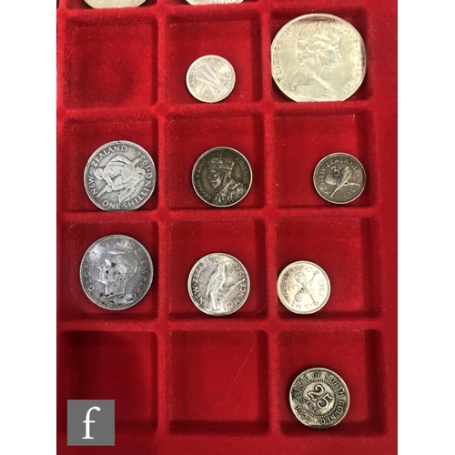 774 - Two trays of coins from Australia, New Zealand and Malaysia to include half crowns, florins, shillin... 