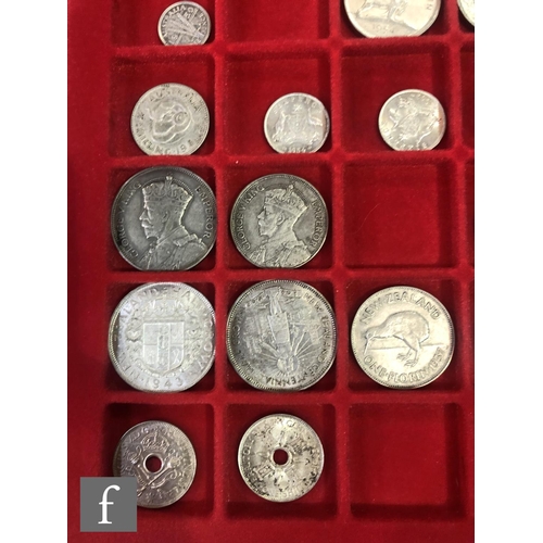 774 - Two trays of coins from Australia, New Zealand and Malaysia to include half crowns, florins, shillin... 