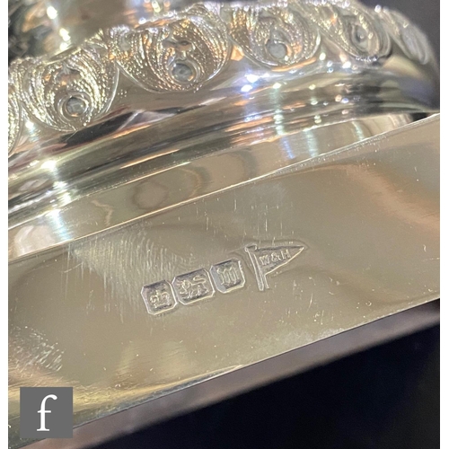 73 - An early 20th Century hallmarked silver table centre piece, square base supporting boat shaped bowl ... 