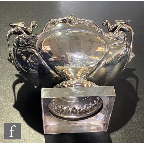 73 - An early 20th Century hallmarked silver table centre piece, square base supporting boat shaped bowl ... 