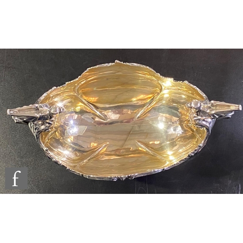 73 - An early 20th Century hallmarked silver table centre piece, square base supporting boat shaped bowl ... 