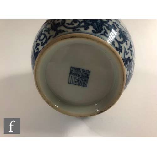 147 - A Chinese blue and white porcelain vase of bottle form applied with iron-red enamels to the central ... 