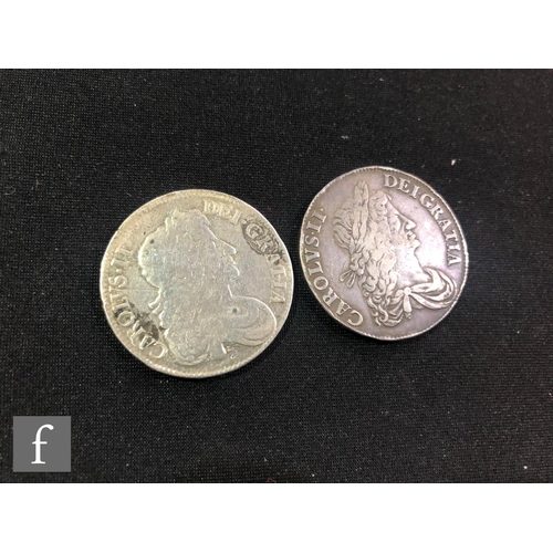 503 - Two Charles II crowns dated 1663 and 1676. (2)