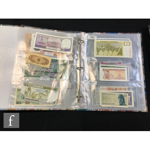 506 - Two albums of European and world bank notes to include Poland, Slovenia, Uzbekistan, Kyrgyzstan, Sou... 