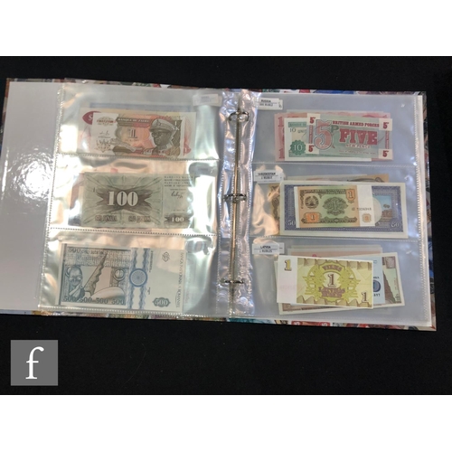 506 - Two albums of European and world bank notes to include Poland, Slovenia, Uzbekistan, Kyrgyzstan, Sou... 