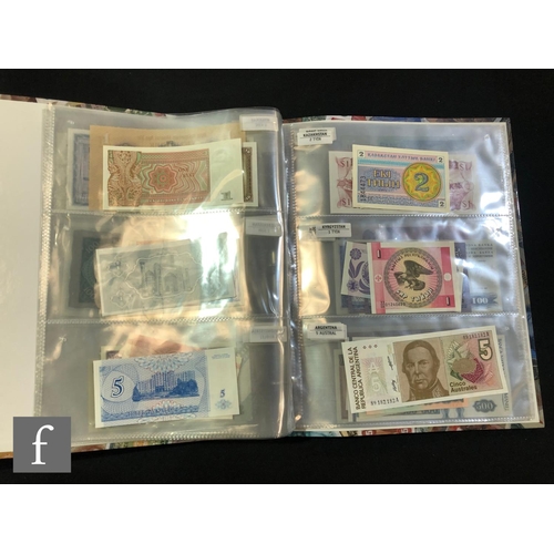 506 - Two albums of European and world bank notes to include Poland, Slovenia, Uzbekistan, Kyrgyzstan, Sou... 