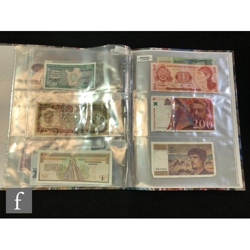 506 - Two albums of European and world bank notes to include Poland, Slovenia, Uzbekistan, Kyrgyzstan, Sou... 