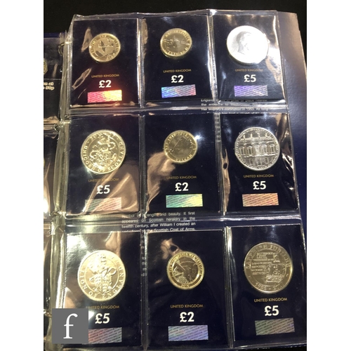 528 - Two Elizabeth II change checker albums of fifty pences to five pound coins including other sets and ... 