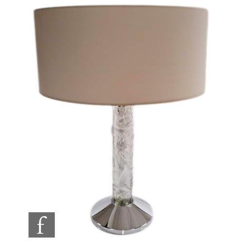 300 - A contemporary Lalique table lamp titled Faunes, the chromed conical base mounted with a clear cryst... 