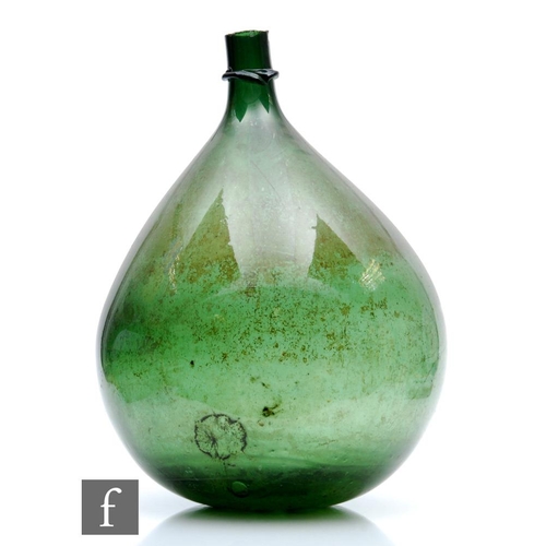 450 - A large late 18th to early 19th Century mouth blown Apothecary's glass carboy of onion form with app... 