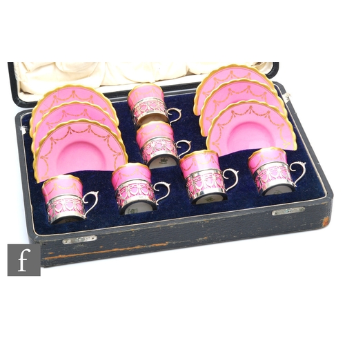 1 - An early 20th Century Aynsley presentation cased set of six coffee cans and saucers in pink with a g... 