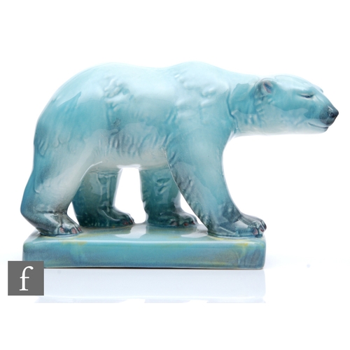 17 - A mid 20th Century model of a polar bear glazed in an ice blue with yellow tints to the rectangular ... 