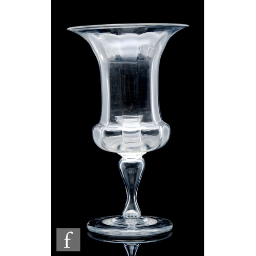 343 - A large late 19th Century clear crystal glass vase, the campana form with vertical fluting, raised t... 