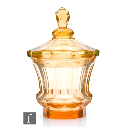 422 - A 20th Century glass lidded vase, of low shouldered and flared form with facet cut decoration, all i... 