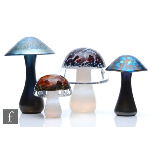 455 - A group of later 20th Century studio glass toadstools of varying size to include two petrol iridesce... 