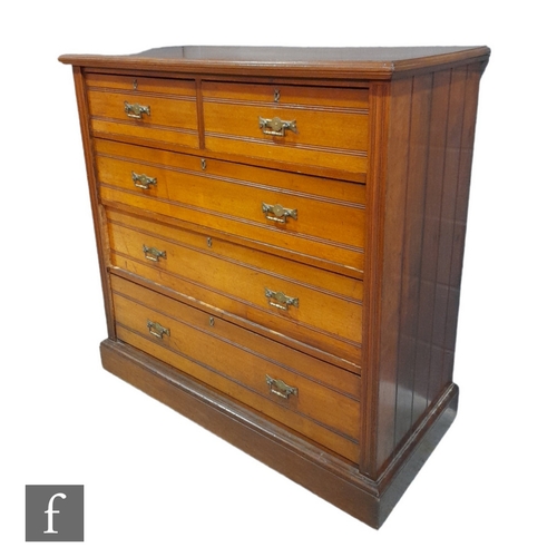 990 - A late 19th Century walnut straight front chest of two short over three long drawers, with ribbed pa... 