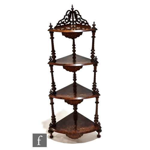 1010 - A Victorian walnut four tier corner what-not, with line inlaid detail and fret-cut gallery to the up... 