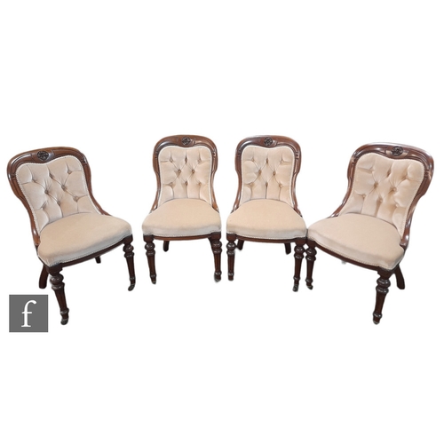 1037 - A set of four late 19th Century walnut salon chairs, the exposed frames carved with rosettes to the ... 