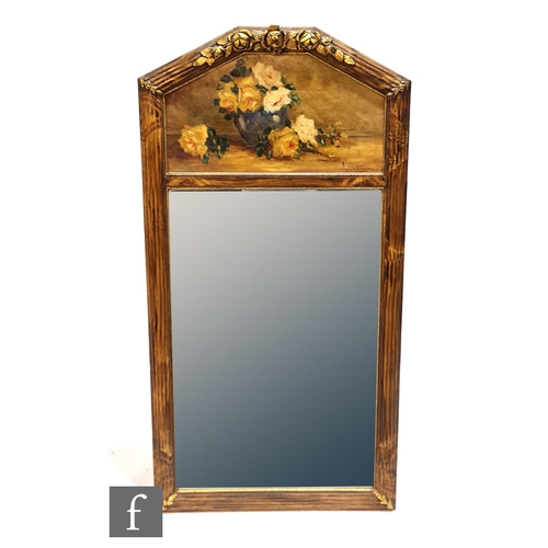 1009 - A 20th Century gilt framed wall mirror, the arch panel painted with a vase and roses within a beaded... 