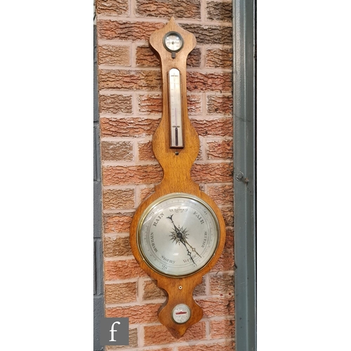 1043 - A 19th Century oak cased wheel barometer incorporating thermometer, hygrometer and level, S/D