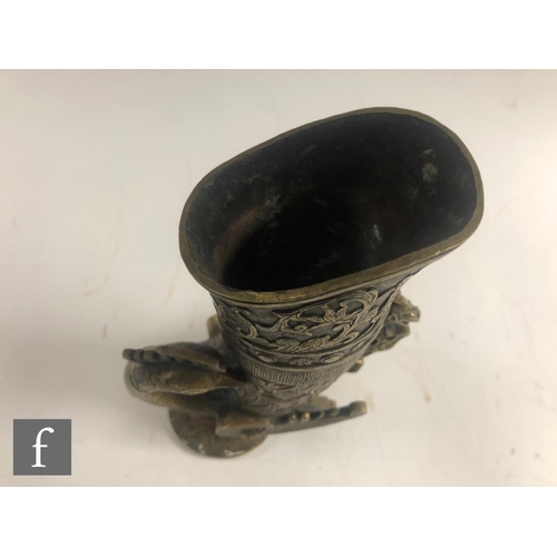 190 - A collection of Asian metalwares, to include a temple bell, a ritual wine vessel, a Qianlong style l... 