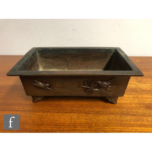 186 - A Chinese late Qing Dynasty (1644-1912) bronze planter or jardinière, the rectangular form vessel ra... 