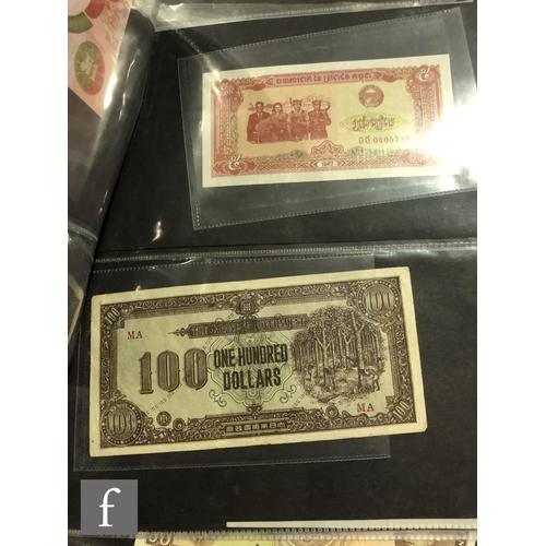 507 - An extensive album of world banknotes to include an American 1857 merchant planters bank for the sta... 