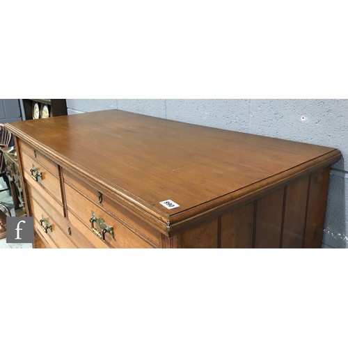 990 - A late 19th Century walnut straight front chest of two short over three long drawers, with ribbed pa... 