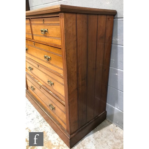 990 - A late 19th Century walnut straight front chest of two short over three long drawers, with ribbed pa... 