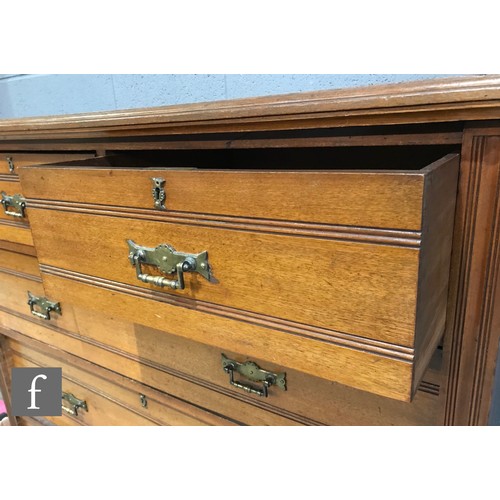 990 - A late 19th Century walnut straight front chest of two short over three long drawers, with ribbed pa... 