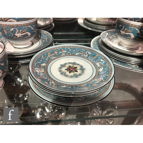 50 - Ten Wedgwood Florentine Turquoise teacups, saucers and side plates together with three 20cm plates, ... 