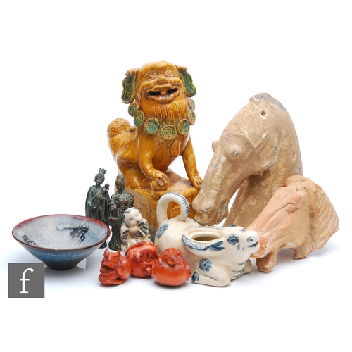 9055 - A collection of Asian items, to include to Chinese Tang Dynasty style pottery horse head figures, he... 