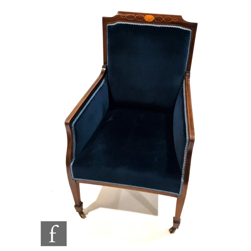 1204 - An Edwardian line inlaid mahogany easy chair on square tapering legs and spade feet, upholstered in ... 